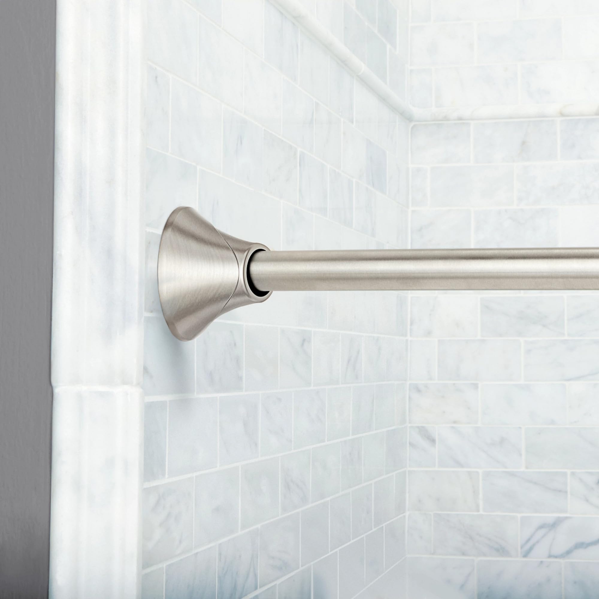 Moen rod holding curtain away illustrating reduced sticking benefit