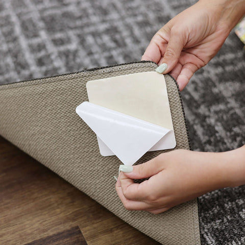 Mohawk Home close-up of double-sided adhesive tab demonstrating strong hold