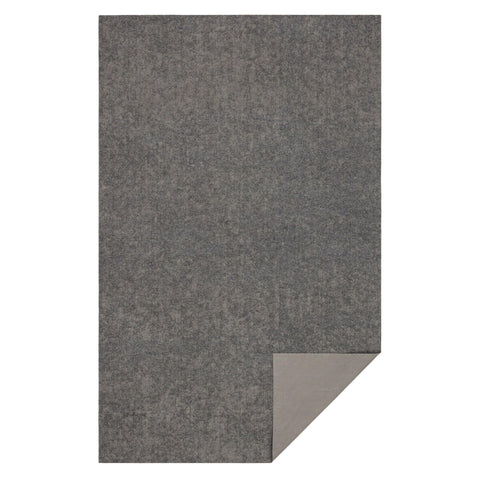 Mohawk Home rug pad next to ruler showing scale for accurate sizing