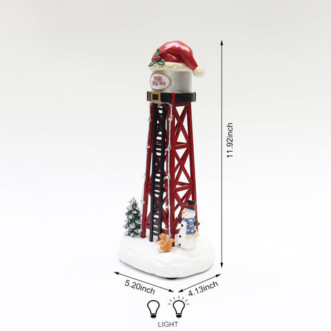 MOMENTS IN TIME water tower lit on a tabletop village, creates warm holiday ambiance