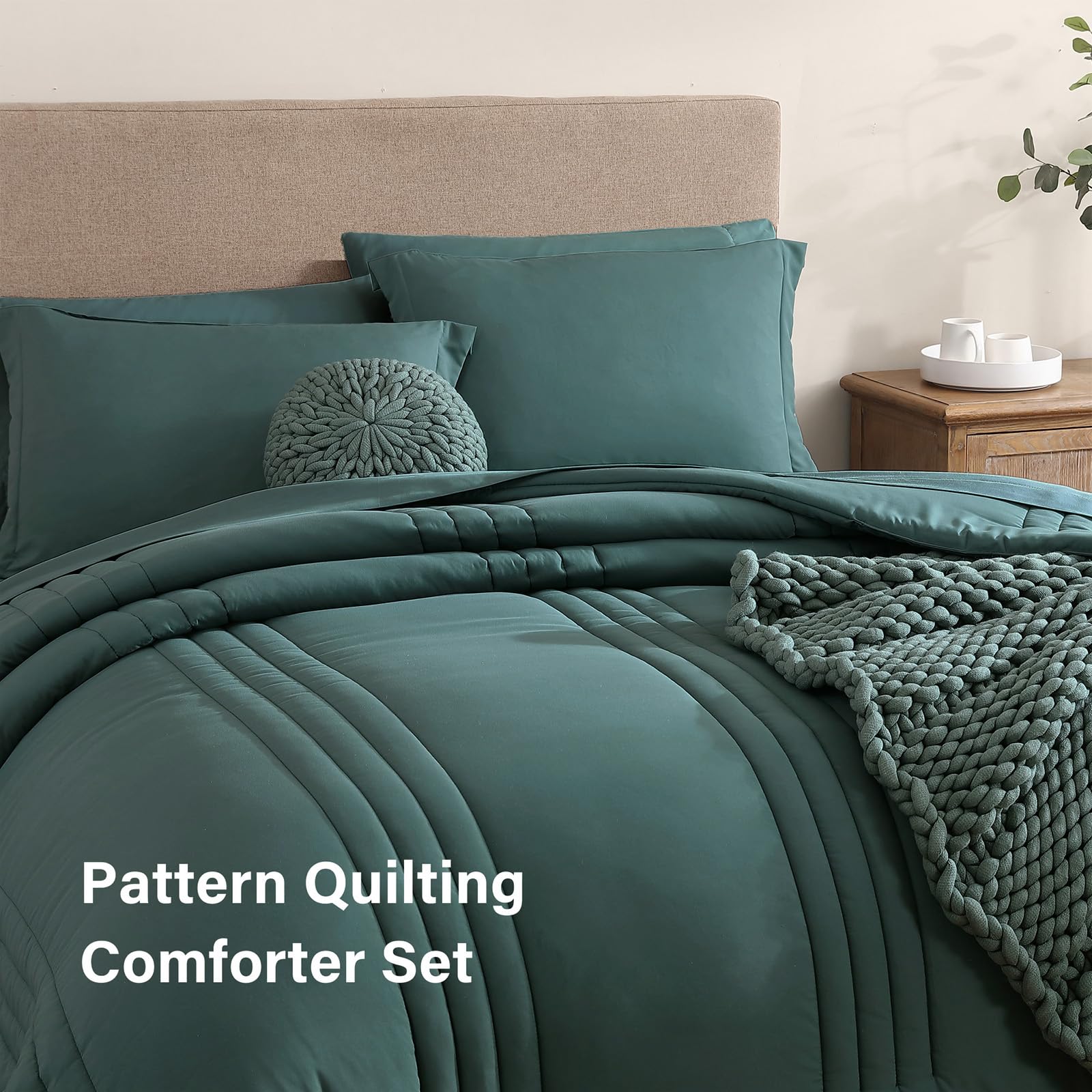 Monbix styled bedroom with blue-green comforter creating calm ambiance