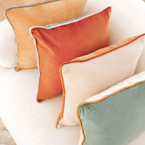 MONDAY MOOSE cushions styled on sofa giving a modern color pop