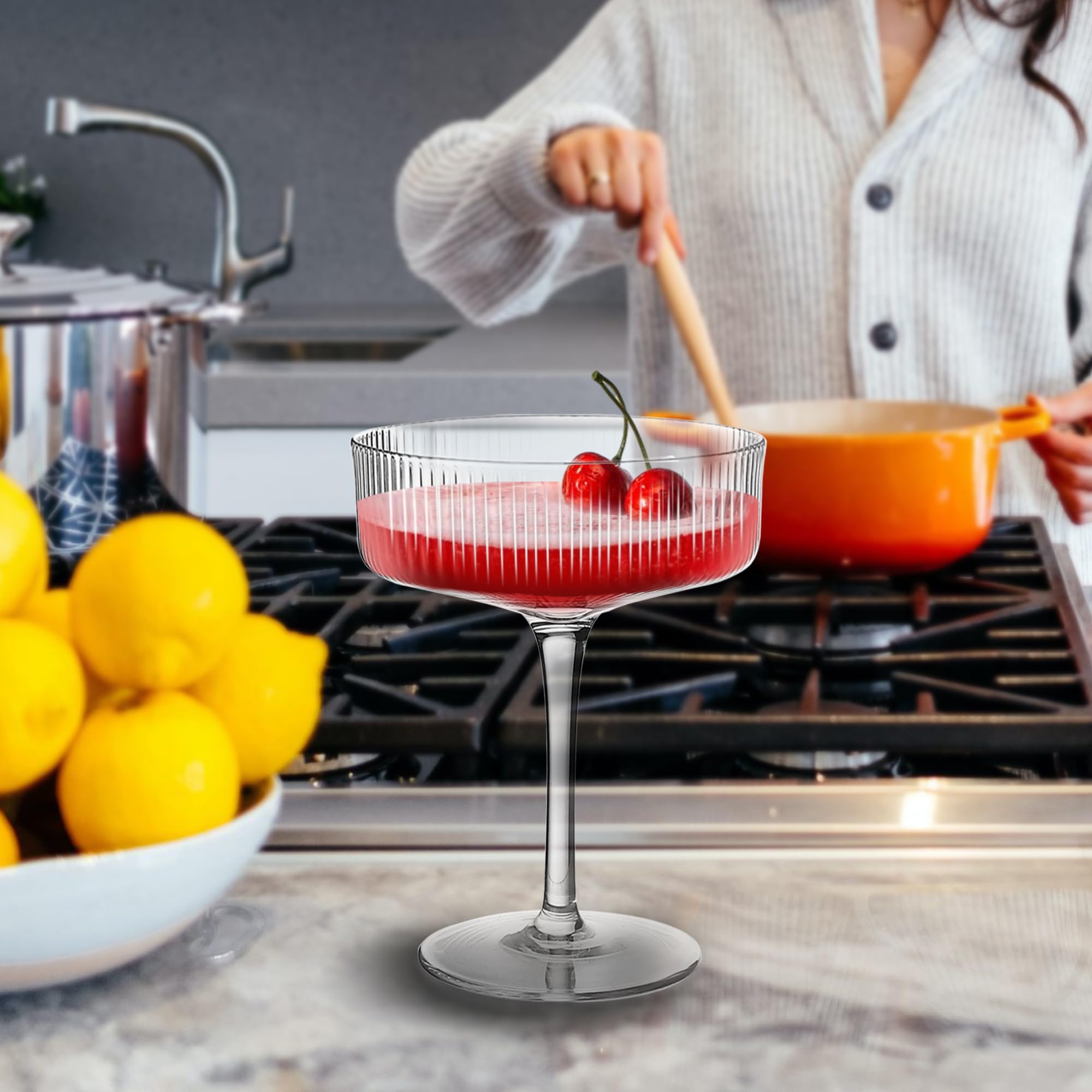 Montex coupe glass held in hand to show 5.5-inch height and comfortable scale