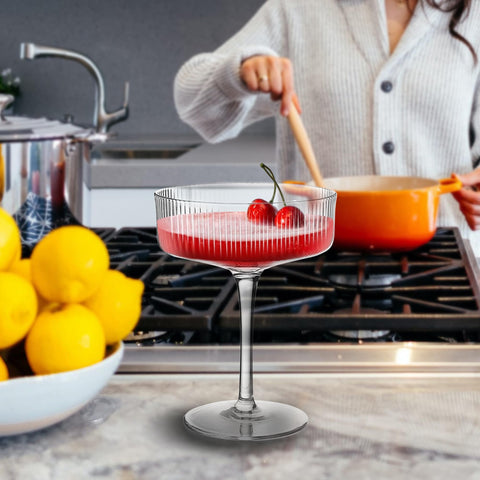 Montex coupe glass held in hand to show 5.5-inch height and comfortable scale