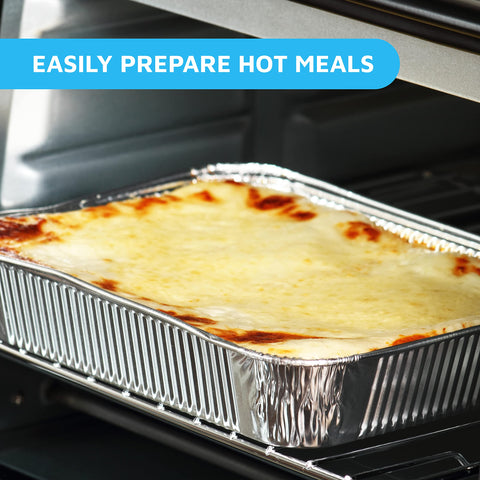 MontoPack pan next to dinner plate showing 9x13 size and portion clarity