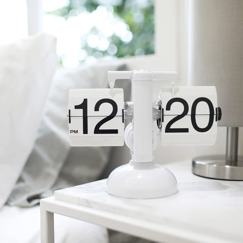 mooas clock on bedside table creates retro décor and functional charm