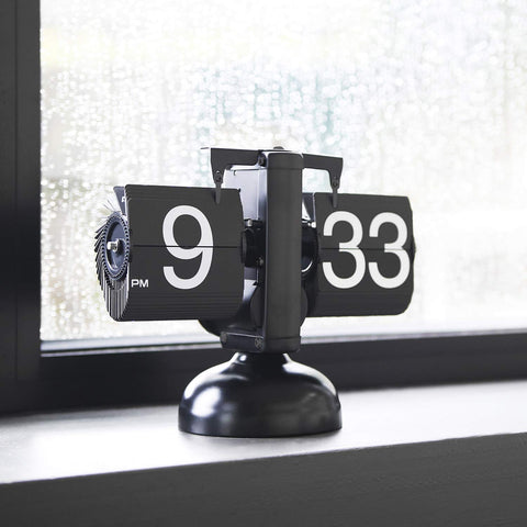 mooas clock beside books shows size and useful scale for desks