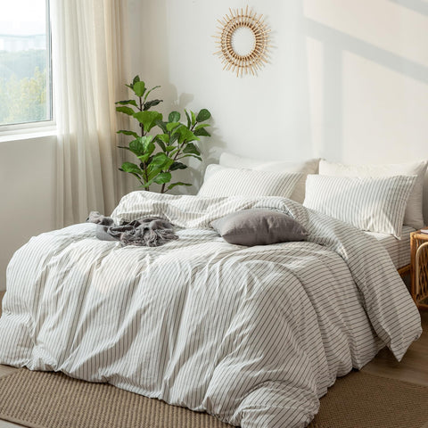 MooMee styled bedroom setting displays relaxed striped bedding aesthetic