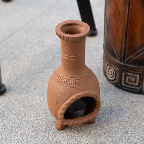 MOUGIGI holder in use with a burning palo santo stick releasing gentle fragrance