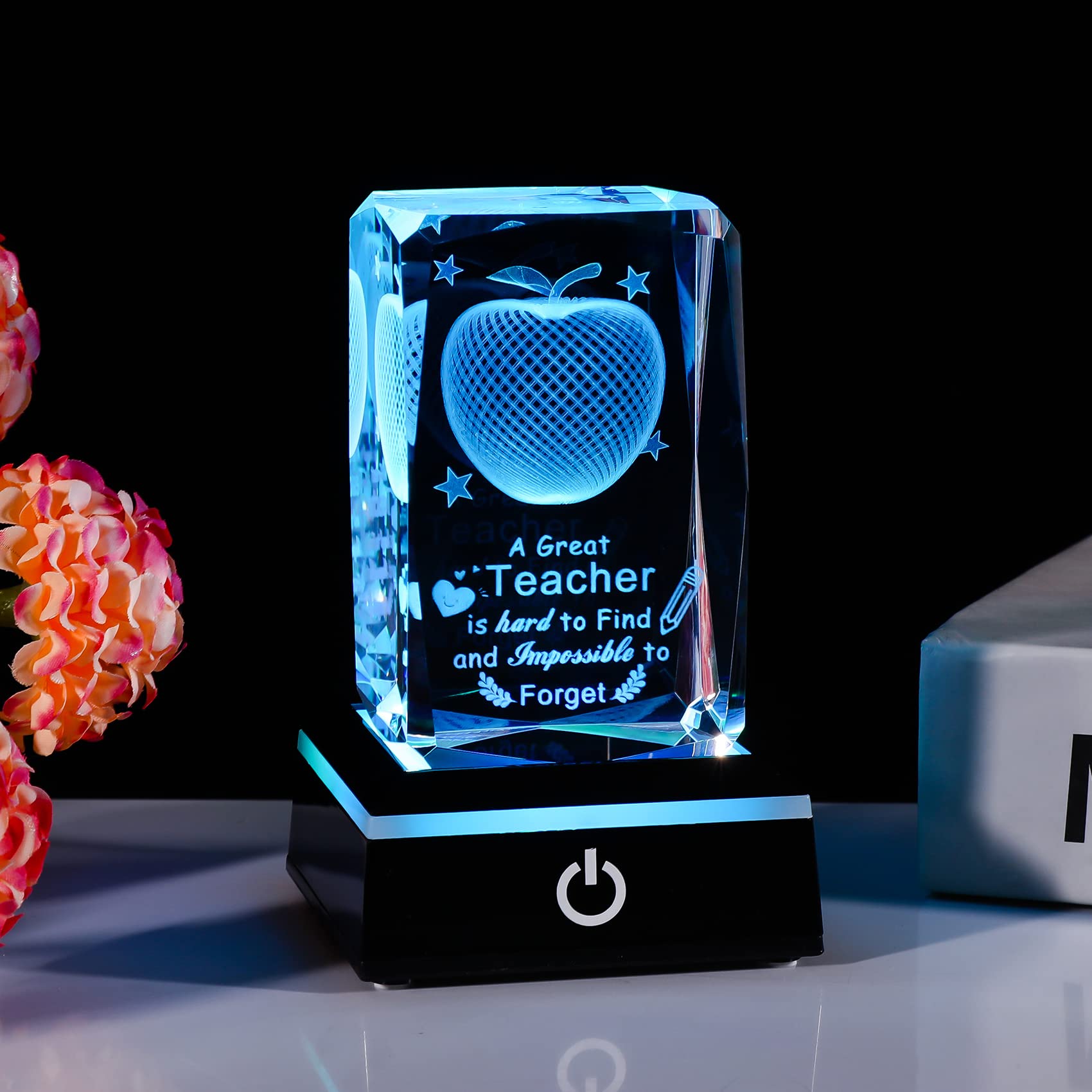 Movdyka side profile of crystal apple revealing detailed 3D laser engraving