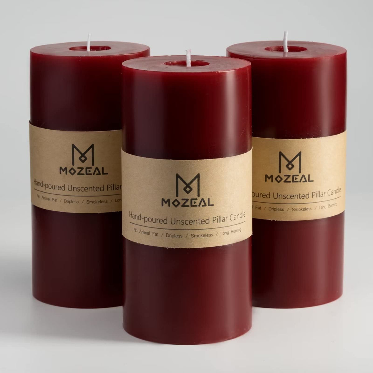 MOZEAL front view of three dark red pillar candles showing rustic finish and shape benefit ambiance