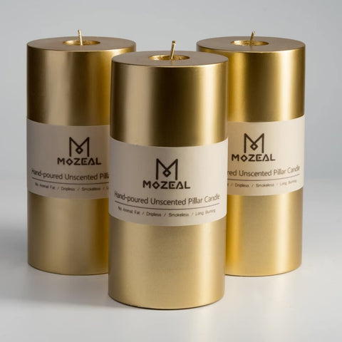 MOZEAL front view of three gold pillar candles showcasing elegant finish and decor-ready look