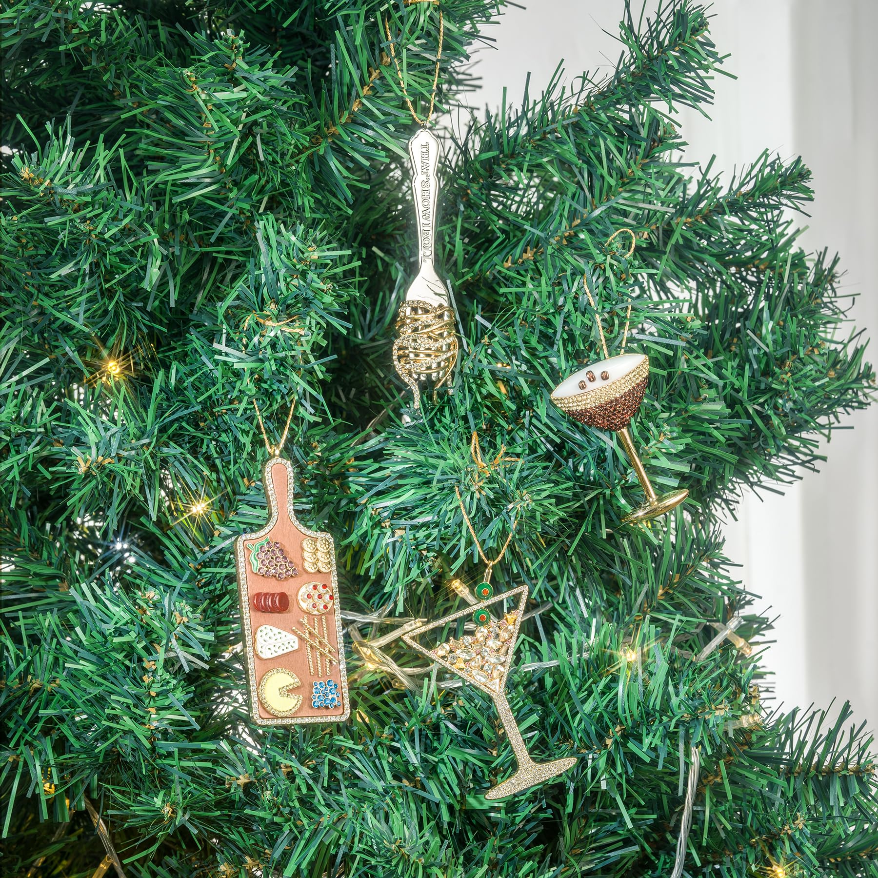 Mrchtmas espresso martini ornament scale next to hand showing compact size