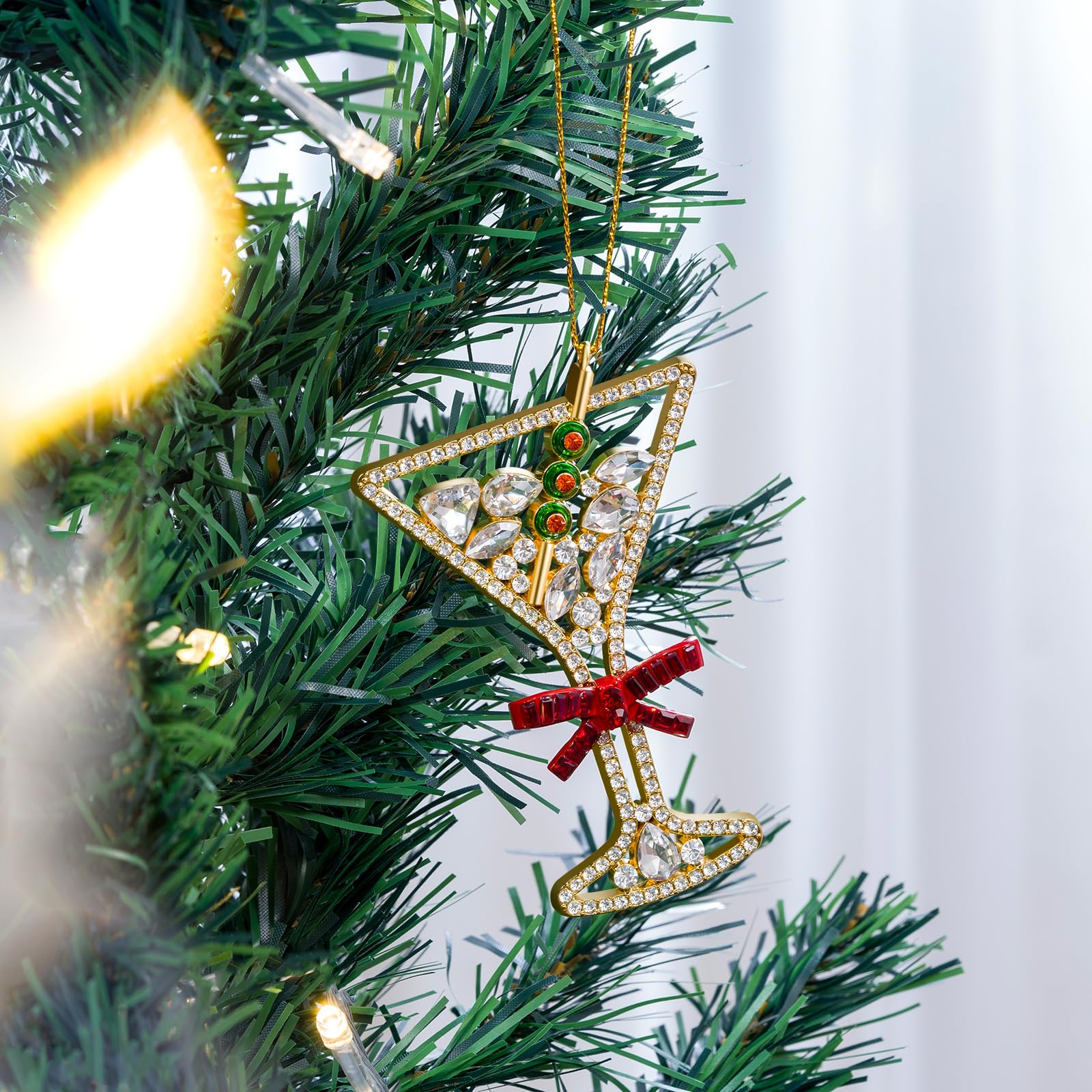 Mrchtmas letter ornament hanging on a Christmas tree adding festive shine