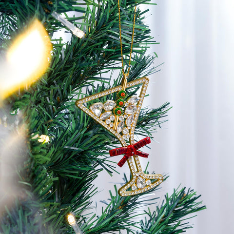 Mrchtmas letter ornament hanging on a Christmas tree adding festive shine
