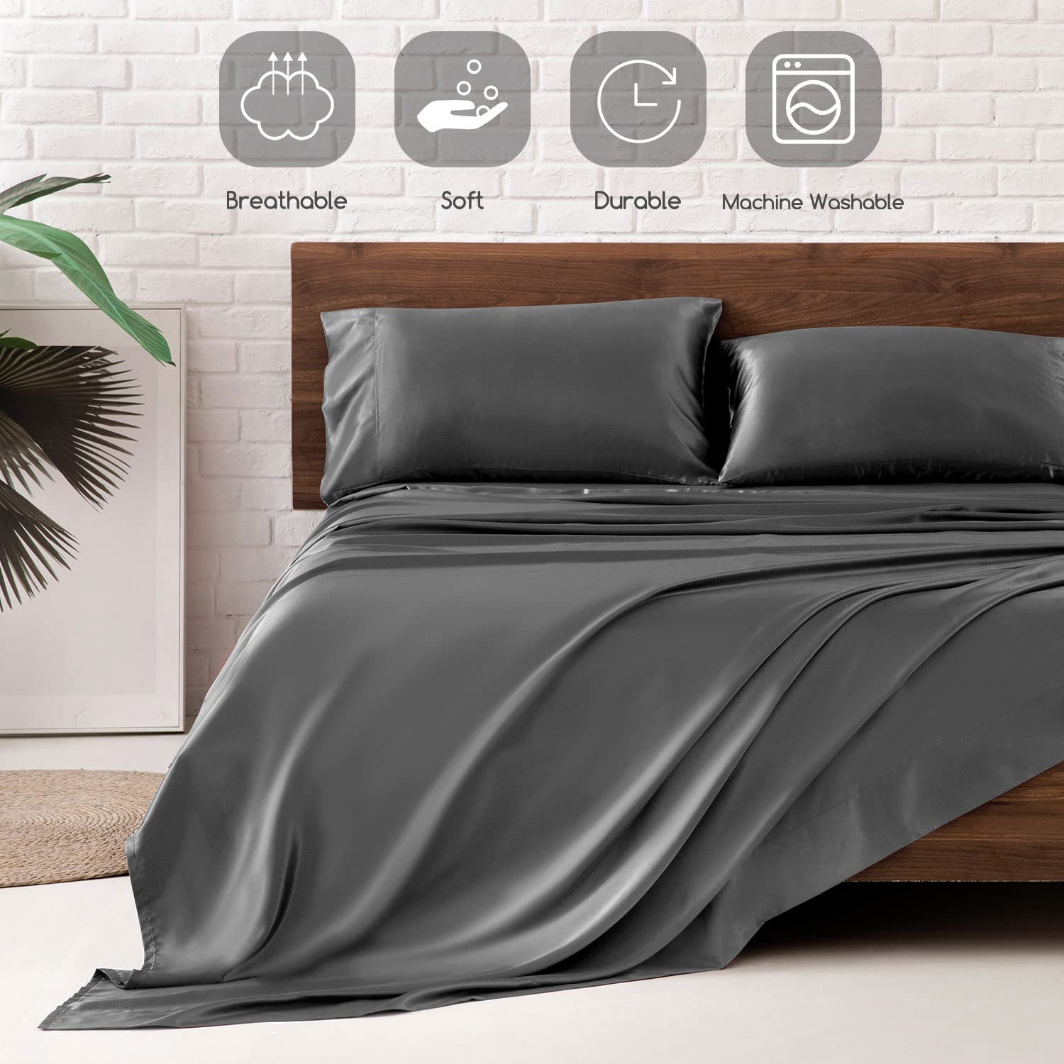 MR&HM styled bed with dark grey sheets giving a polished bedroom look