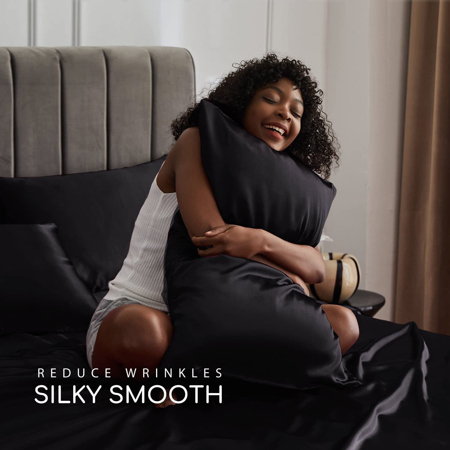 MR&HM flat sheet full spread on bed showing smooth satin drape and luxe appearance