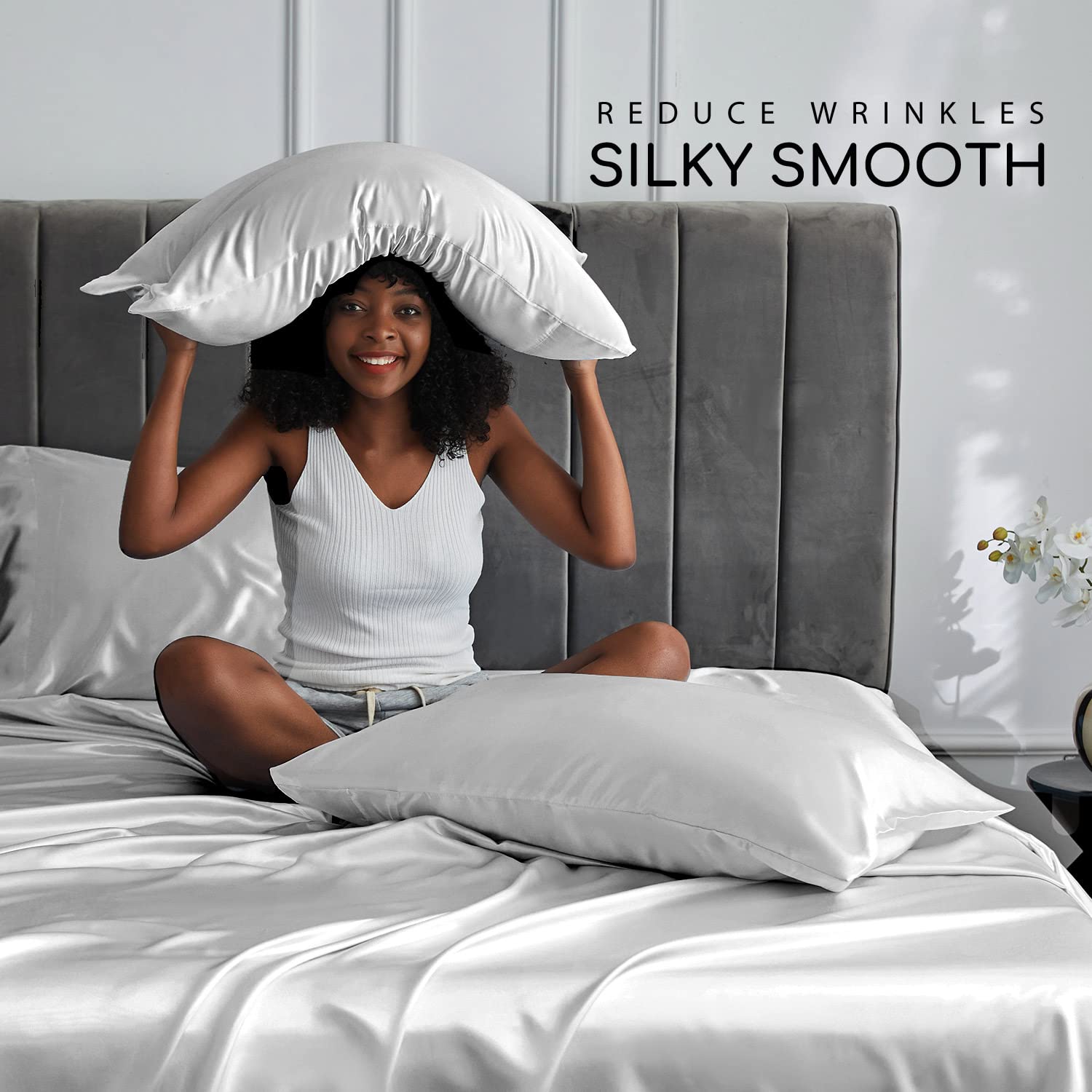 MR&HM flat sheet spread on bed highlighting drape and luxurious sheen