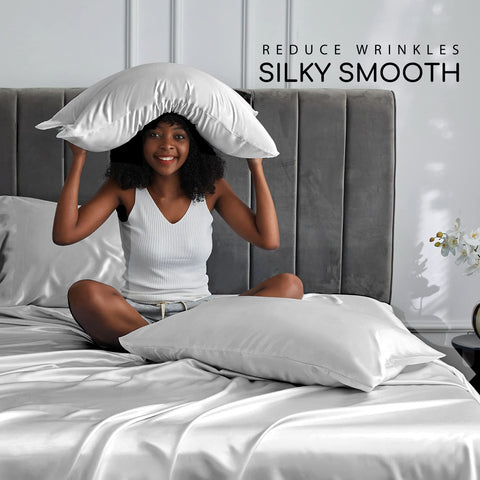 MR&HM flat sheet spread on bed highlighting drape and luxurious sheen
