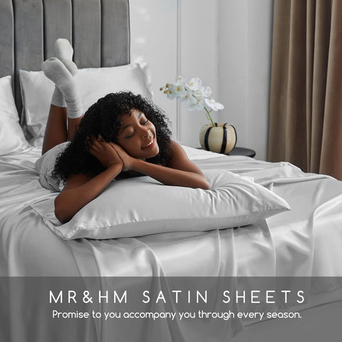 MR&HM sheet set styled on made bed showcasing elegant bedroom atmosphere