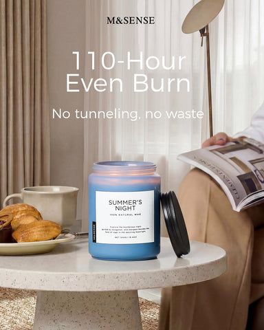M&SENSE candle next to book showing 19.4oz scale for size reference