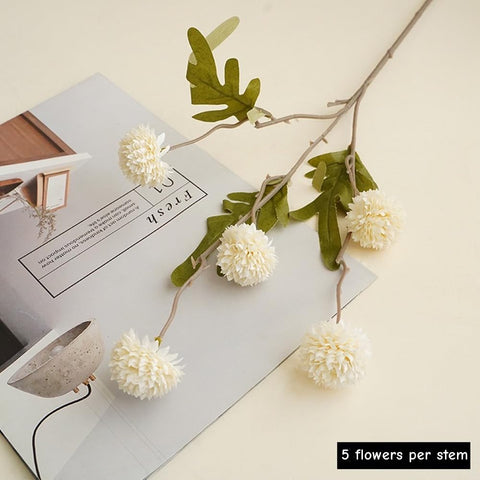 MSIUE faux mums styled in a tall vase demonstrating instant centerpiece impact