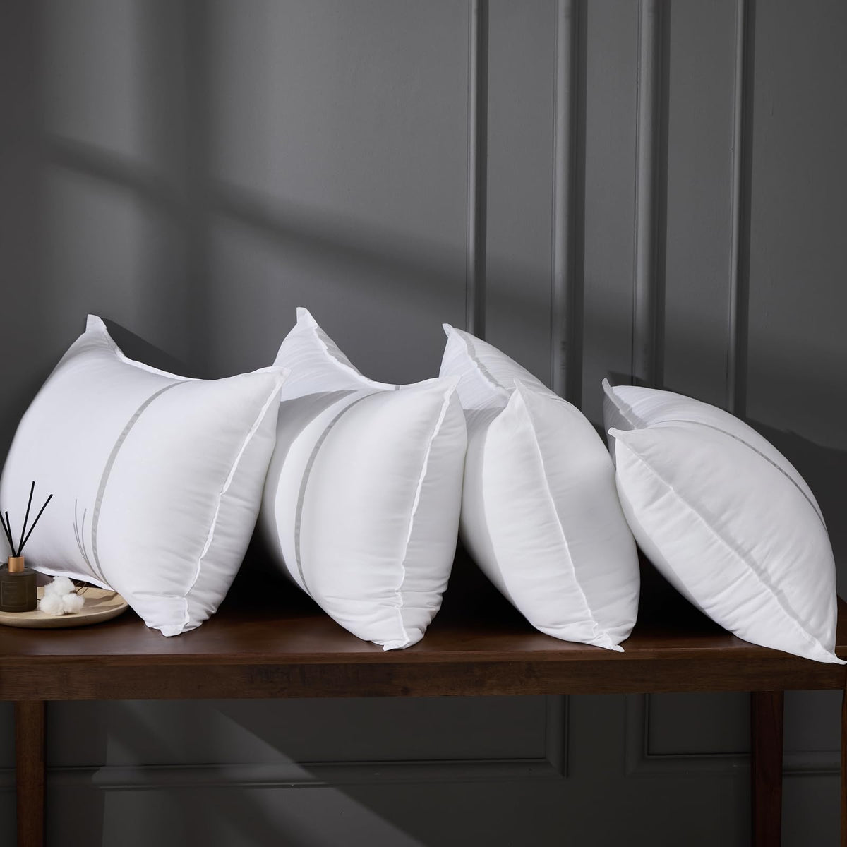 MUFEW front packaging showing four true-to-size pillows and neat stacking benefit