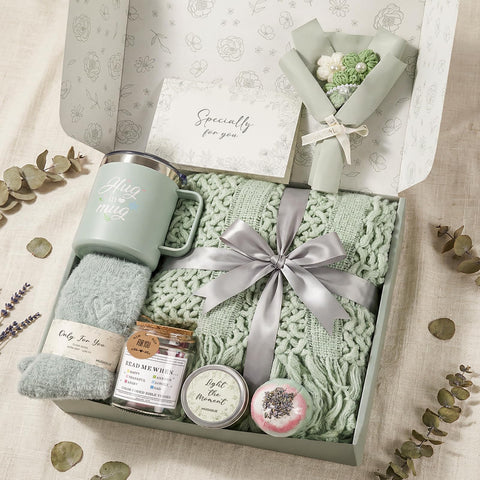 MUGIQUE gift box front view showing assembled care package and ready-to-gift presentation