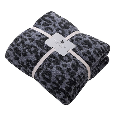 MH MYLUNE HOME rolled blanket in travel bag showing packable comfort for trips