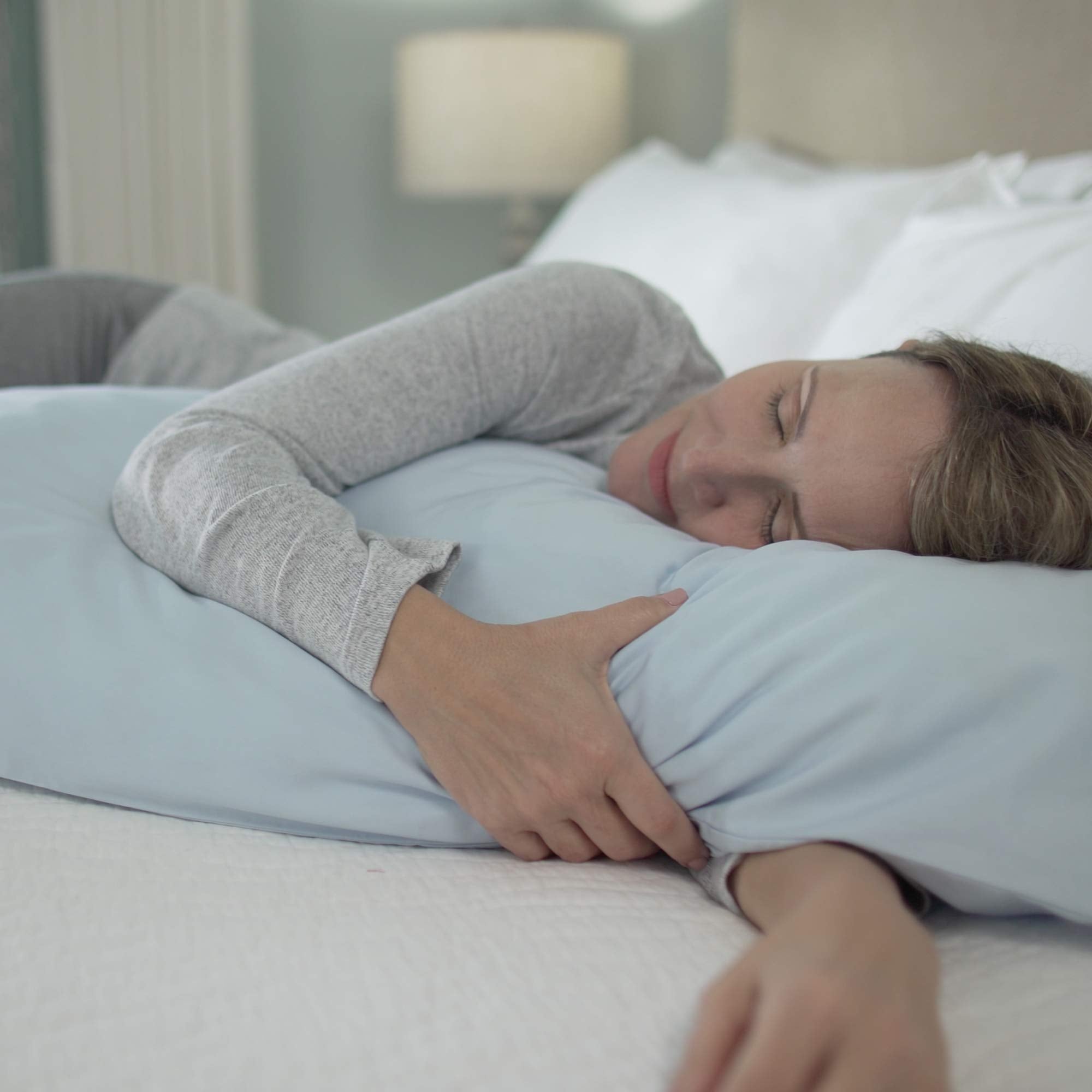 MyPillow in-bed lifestyle with side sleeper demonstrating alignment and relaxation benefit