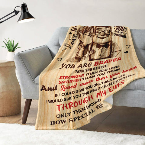 NAIREG blanket wrapped around couple snuggling, conveys intimacy and warmth