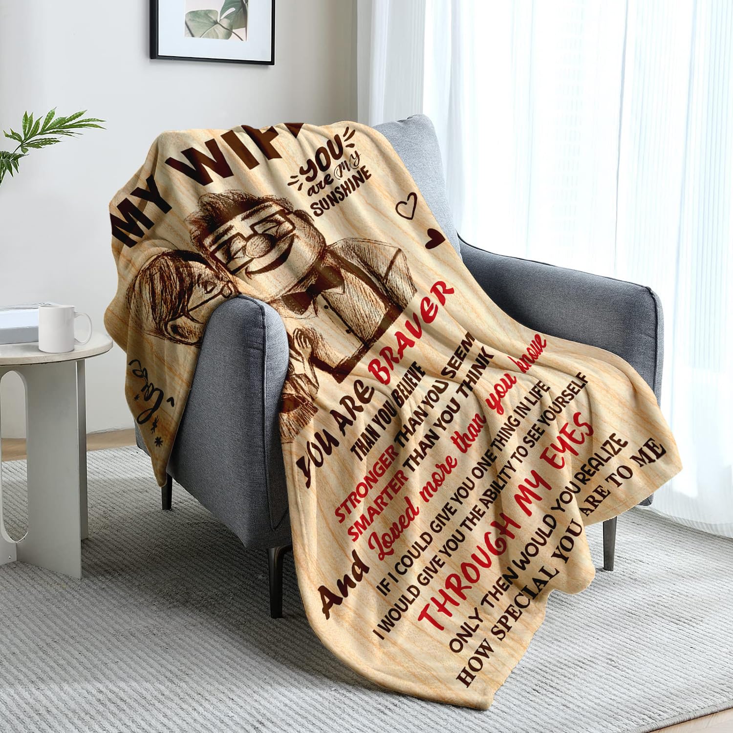 NAIREG blanket on sofa with scale reference, demonstrates 50x60 size suitability