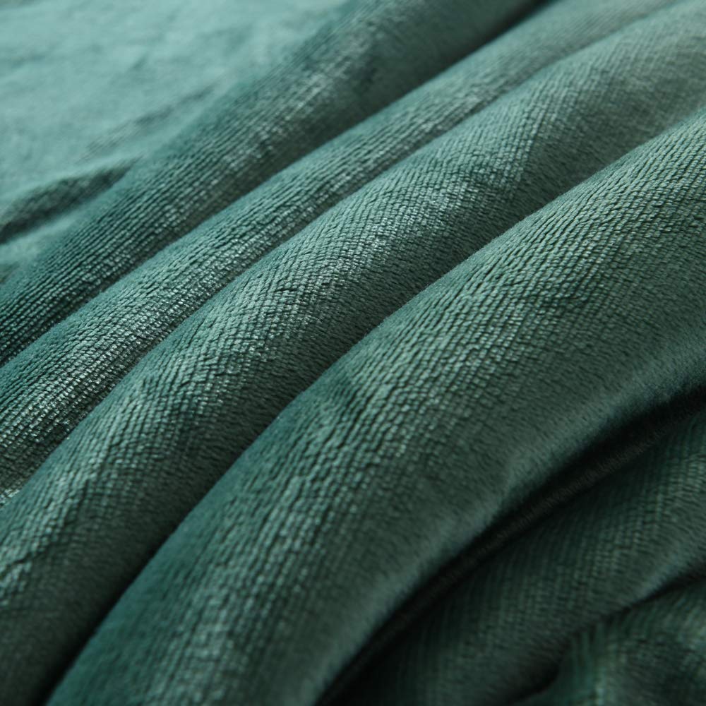 NANPIPER blanket folded in backpack demonstrating travel-friendly compactness