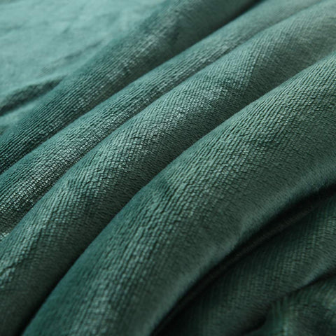 NANPIPER blanket folded in backpack demonstrating travel-friendly compactness