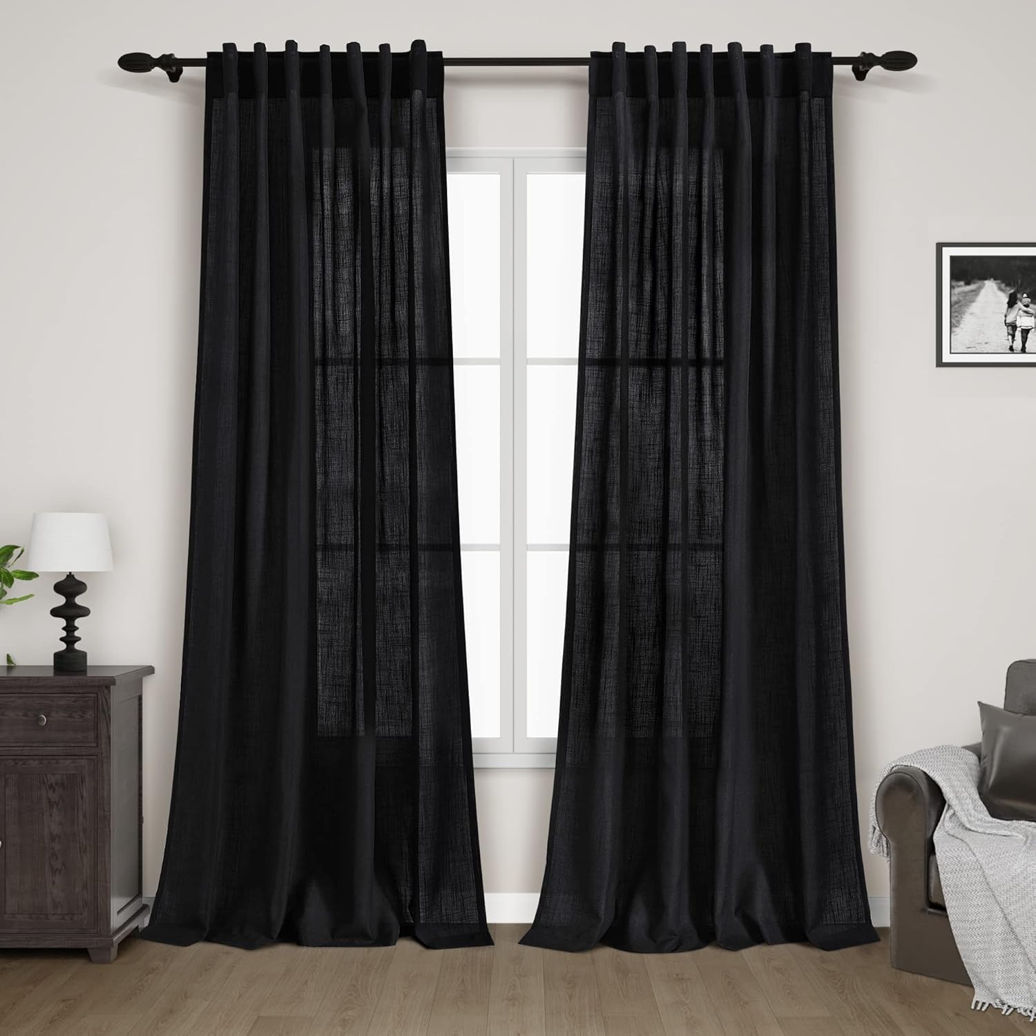 Nanspring front view of two black linen curtain panels, shows neat fold and hem