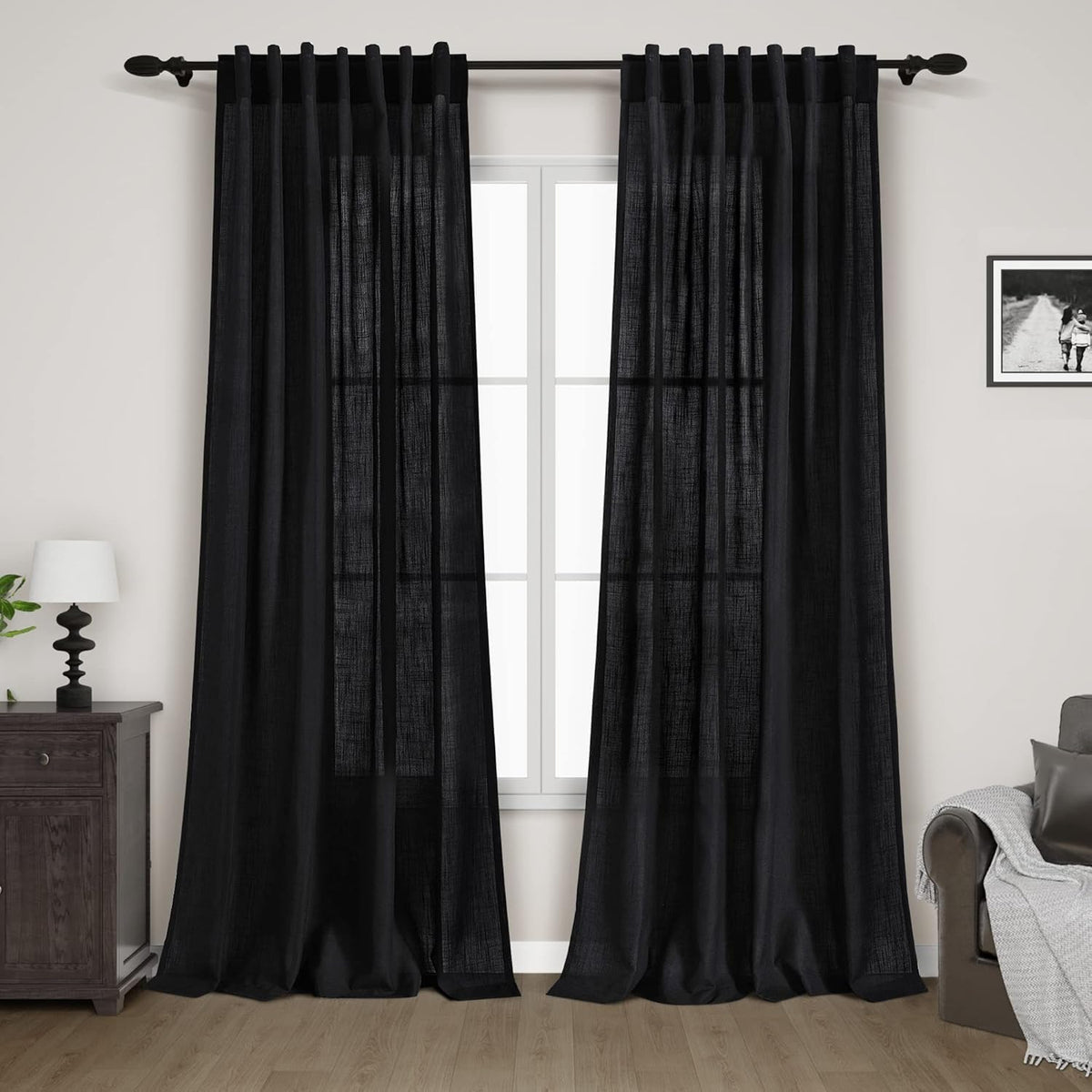 Nanspring front view of two black linen curtain panels, shows neat fold and hem