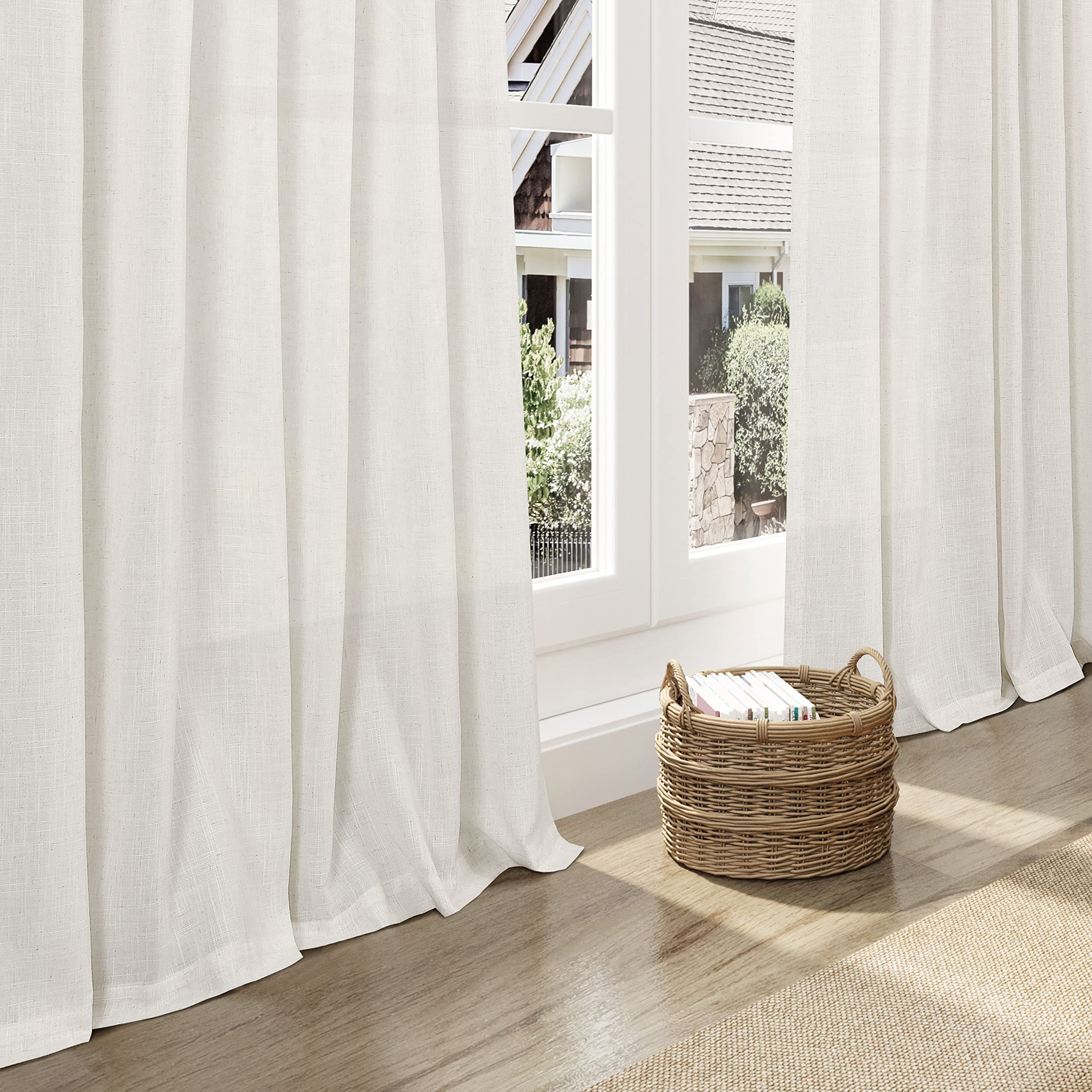 Nanspring curtains beside sofa showing 108-inch length for tall windows