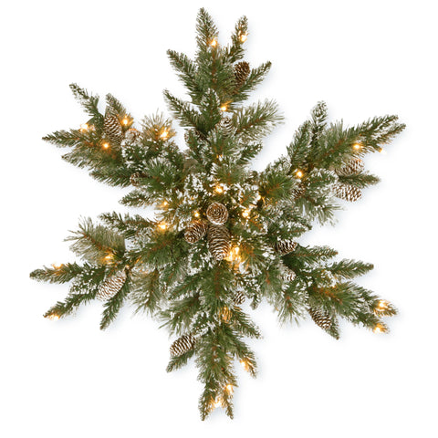 National Tree Company 32in front view snowflake wreath showing glittered bristle pine and pine cones, festive entryway focal point