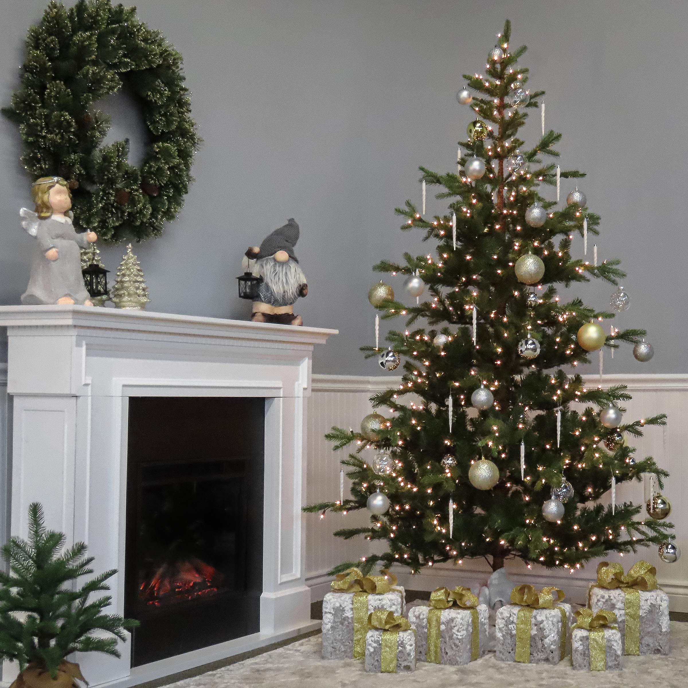 National Tree Company hands fluffing branches during setup showing easy assembly and shaping benefit