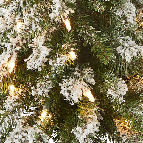 National Tree Company close-up of flocked branch tips highlighting lifelike texture and soft snow effect