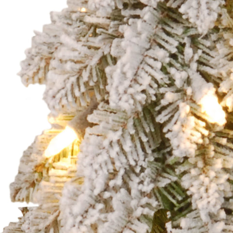 National Tree Company mini tree lit on a side table offering warm white light and cozy holiday atmosphere