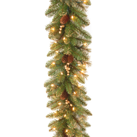 National Tree Company garland front view showing pinecones and berries with warm lights enhancing decor