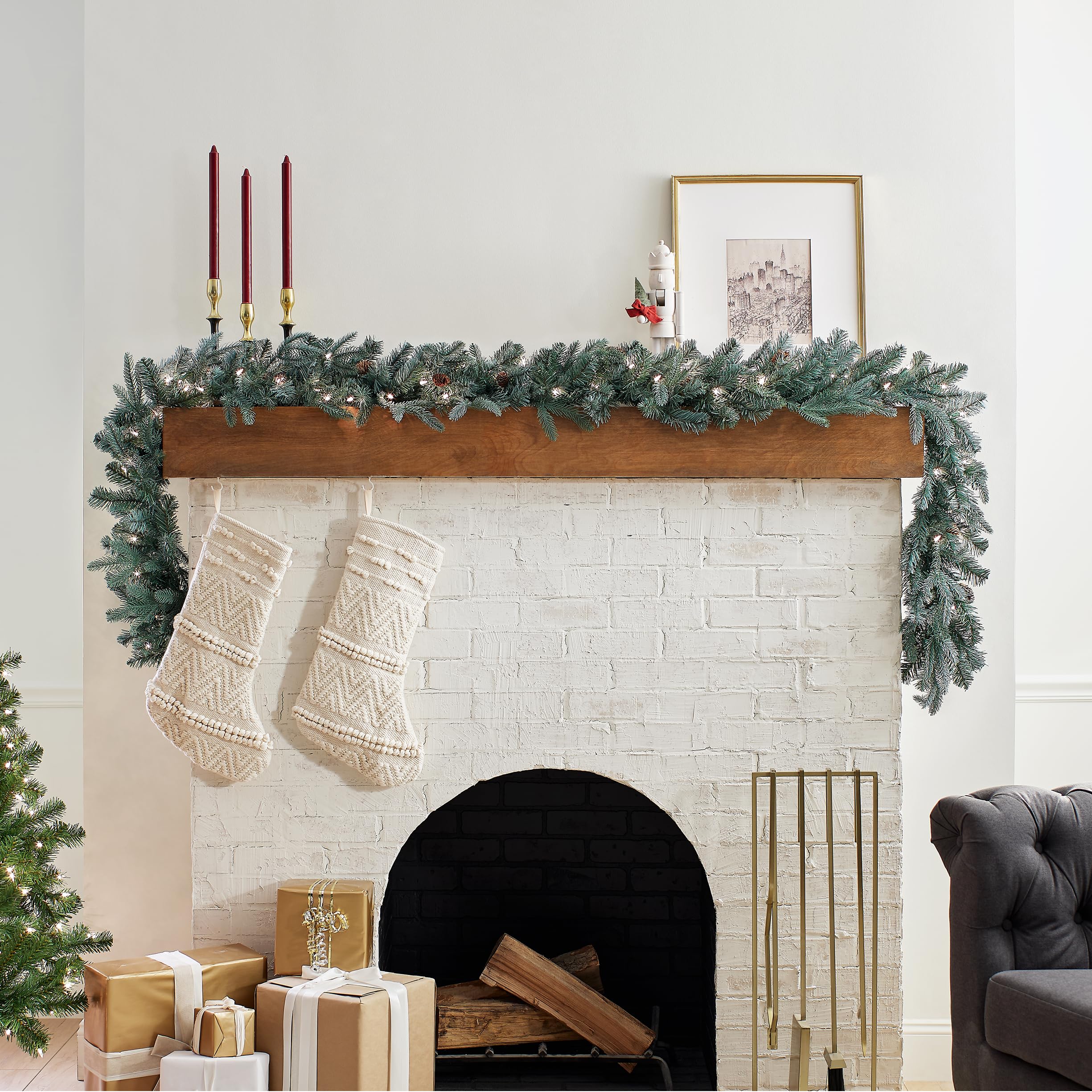 National Tree Company garland lit on mantel with warm white lights, creates cozy ambiance