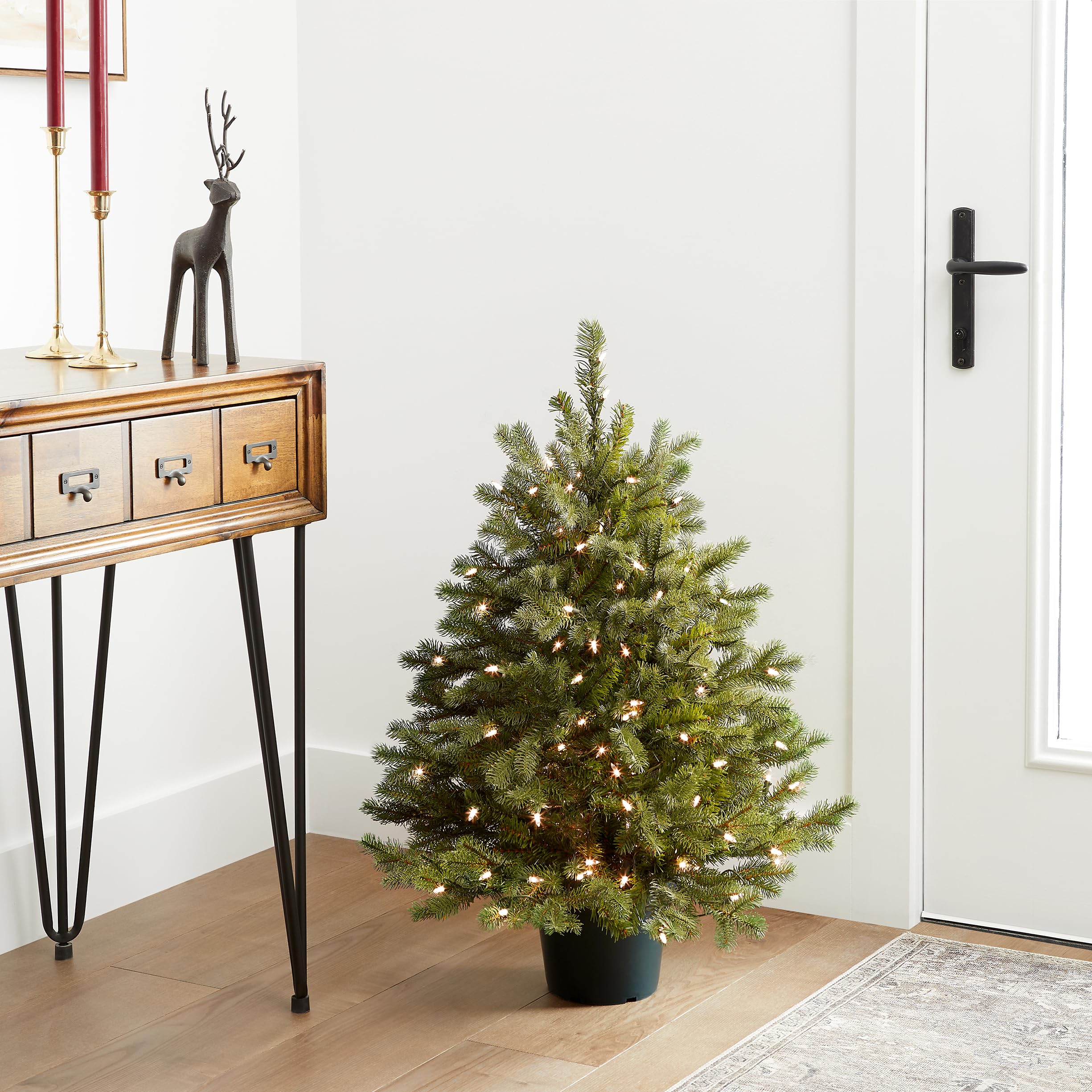 National Tree Company styled living room with Hampton Spruce adding festive ambiance