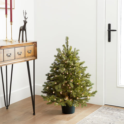 National Tree Company styled living room with Hampton Spruce adding festive ambiance
