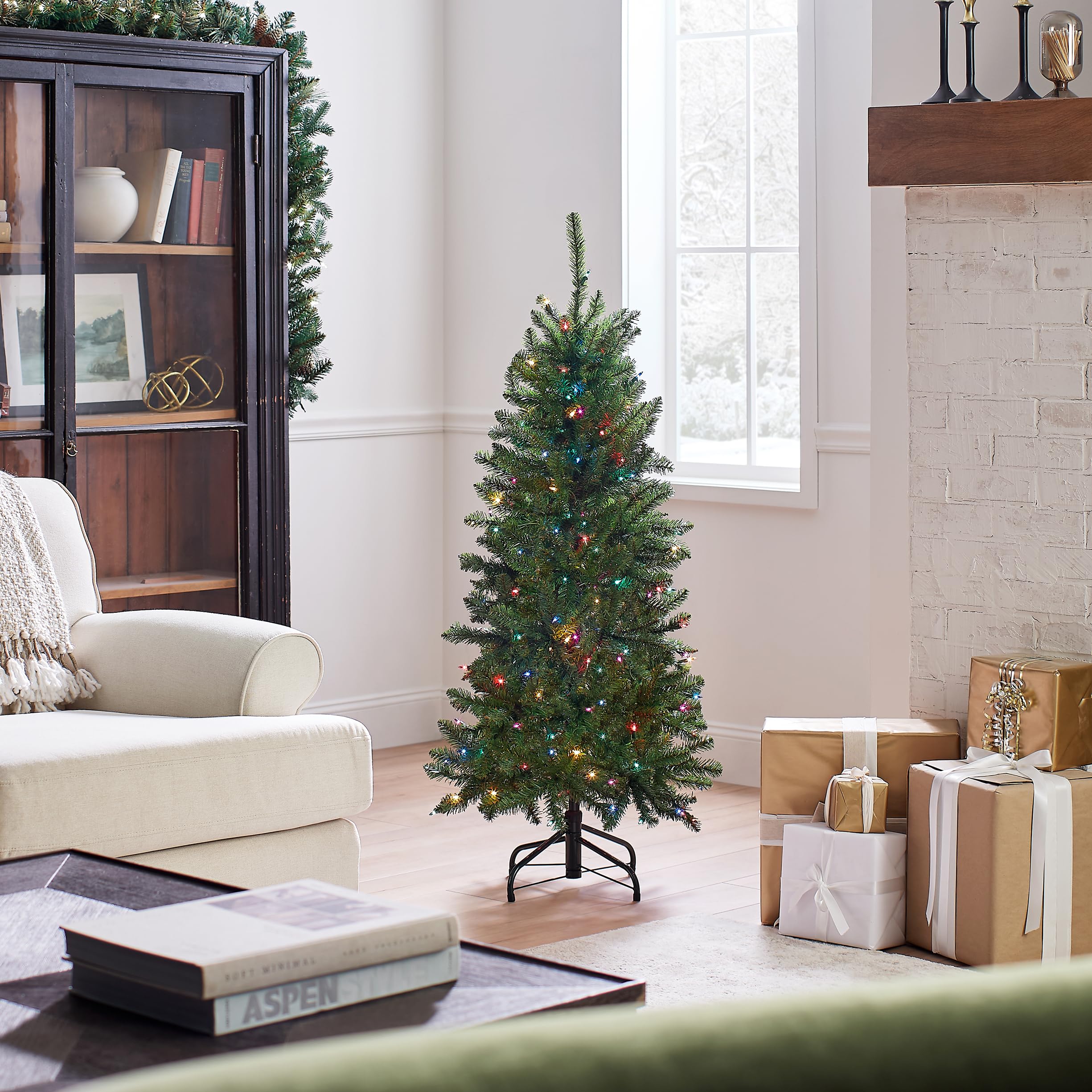 National Tree Company tree in living room showing space-saving fit and festive atmosphere