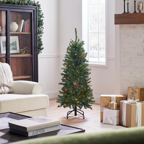National Tree Company tree in living room showing space-saving fit and festive atmosphere