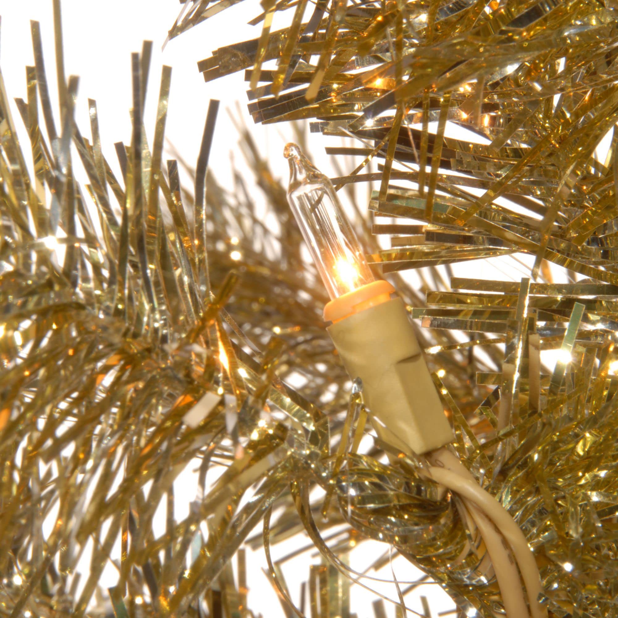 National Tree Company lit tree in living room offering ambient holiday lighting benefit