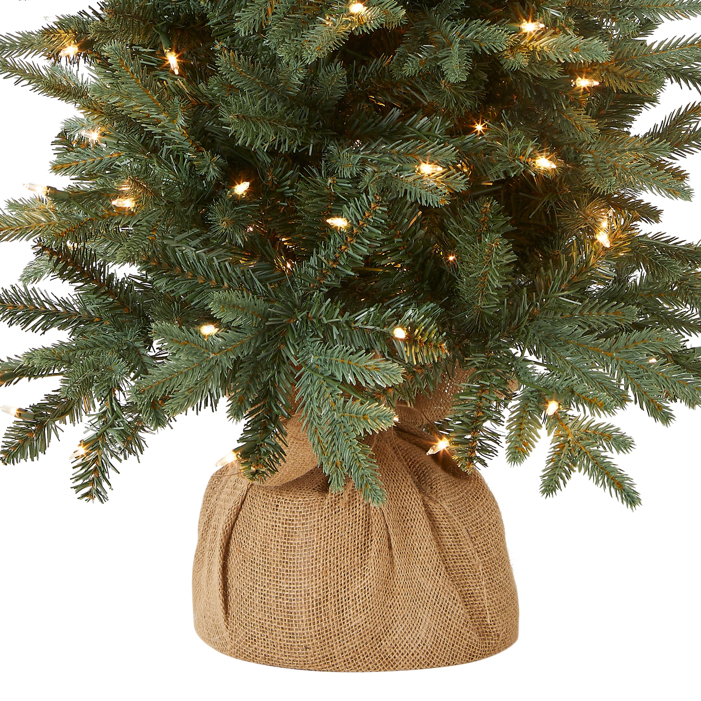 National Tree Company pre-lit lights glowing on branches illustrating easy setup and warm ambiance