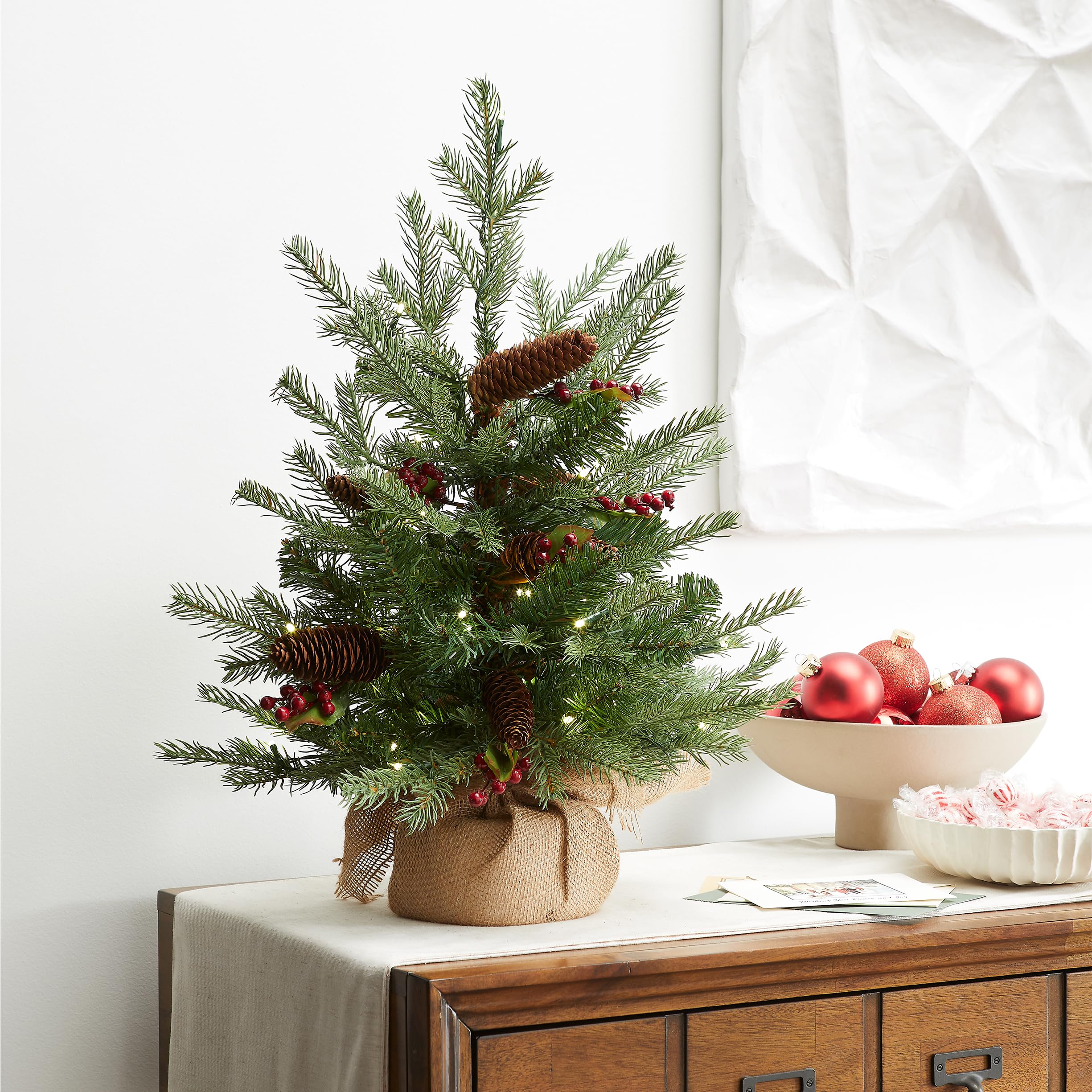 National Tree Company metal base and hinged branches visible for stable, easy setup